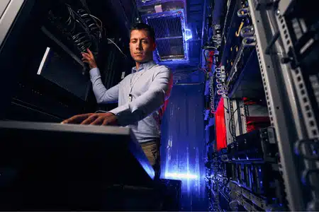 IT professional configures servers in a data center as part of comprehensive IT support